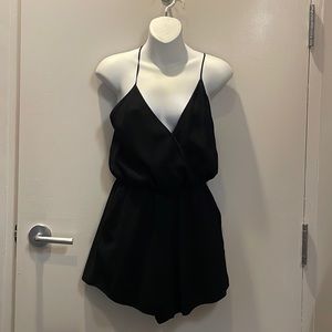 Black shorts jumpsuit (onesie) from Aritzia. Size small. Open back. Pockets.